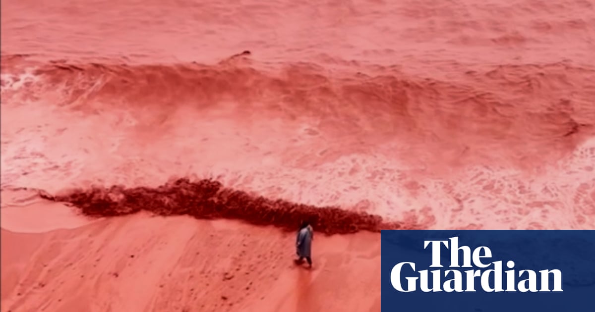 Rainfall creates crimson spectacle at beach on Iran’s Hormuz Island