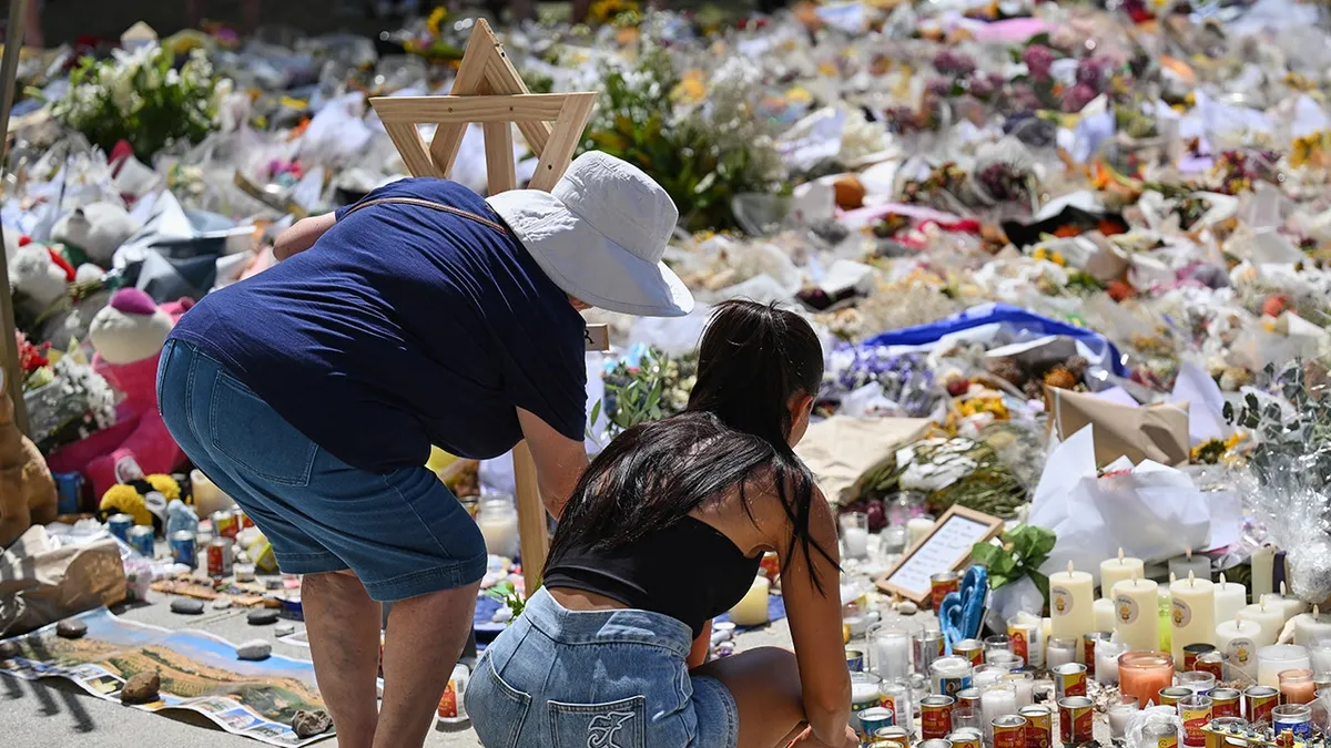 Australia anti-terror police detain 7 men as country lays youngest Bondi Beach victim to rest