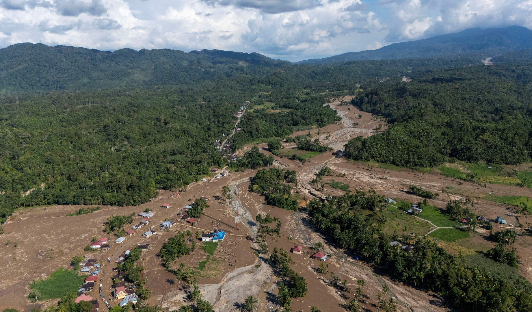 Indonesia races to find missing after massive floods, landslides