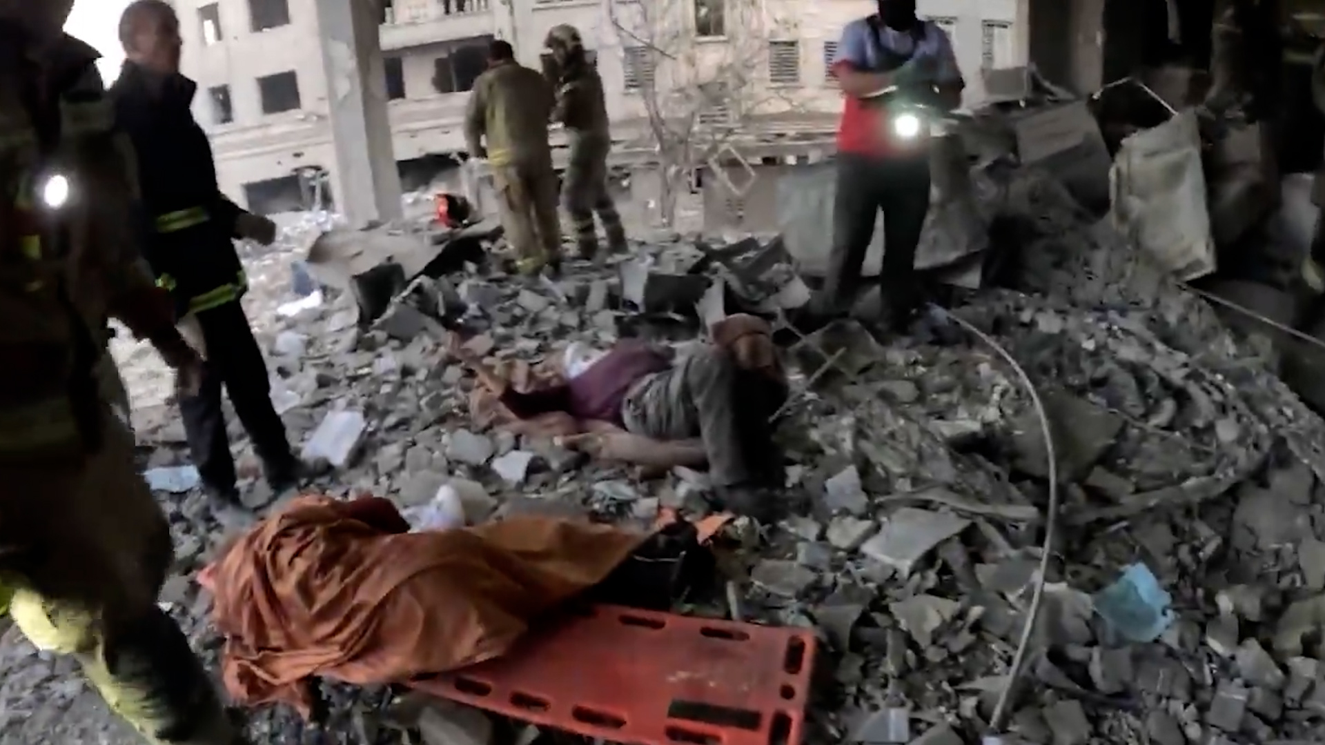 Iranian rescuers save two civilians from rubble after US-Israeli strikes