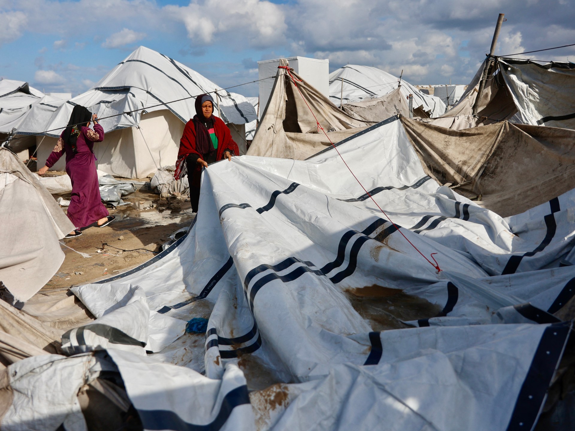 Gaza storm kills Palestinian woman as Israeli curbs on aid compound misery