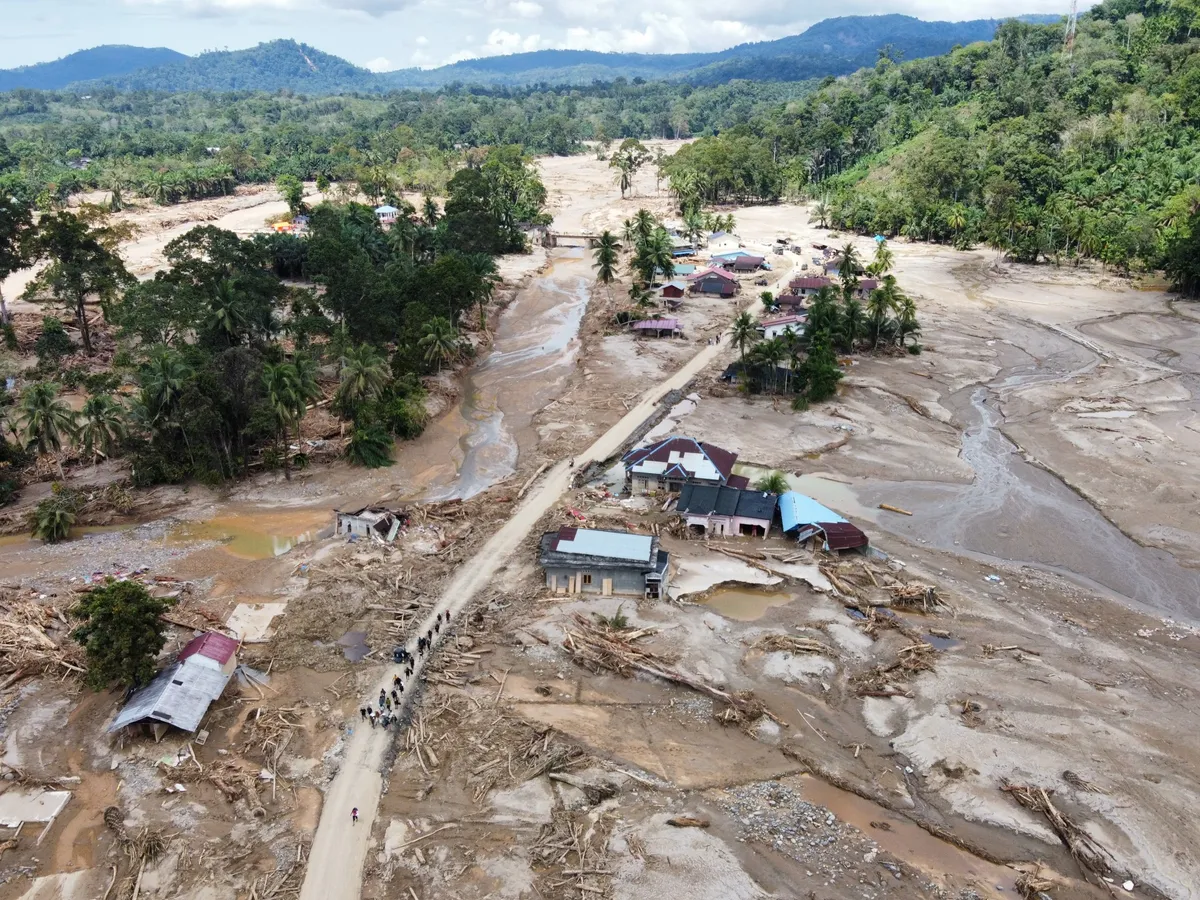 ‘I decided I’d die’: Indonesia’s flood victims recount stories of survival