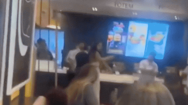 McDonald's customer caught on camera launching flying kick at employee during heated brawl