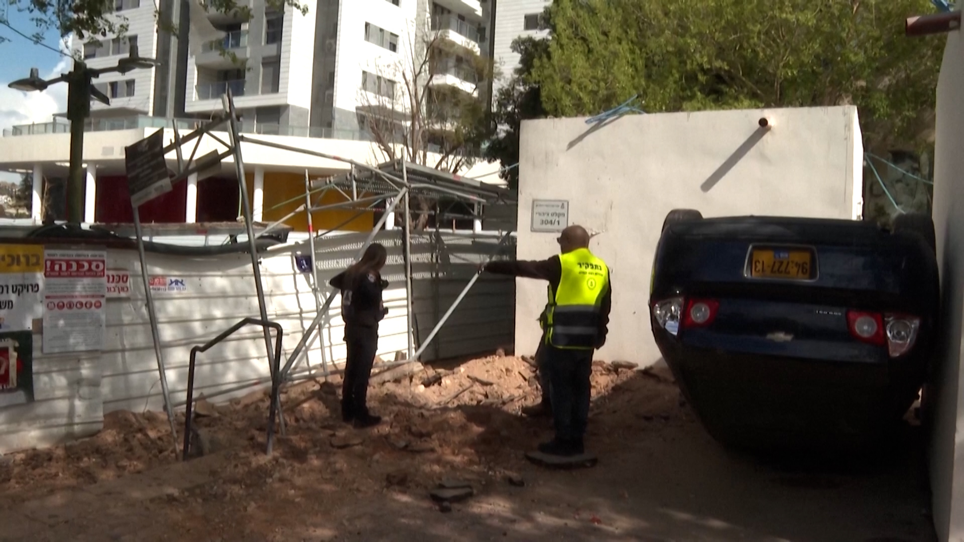 Iranian missile strike damages cars and street in Israel