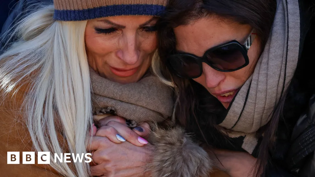 Raw emotions as mourners attend Mass for Swiss bar fire victims