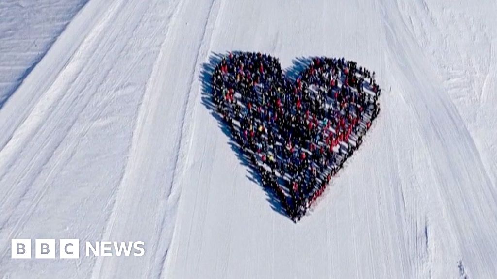Skiers create heart-shaped tribute for Switzerland fire victims