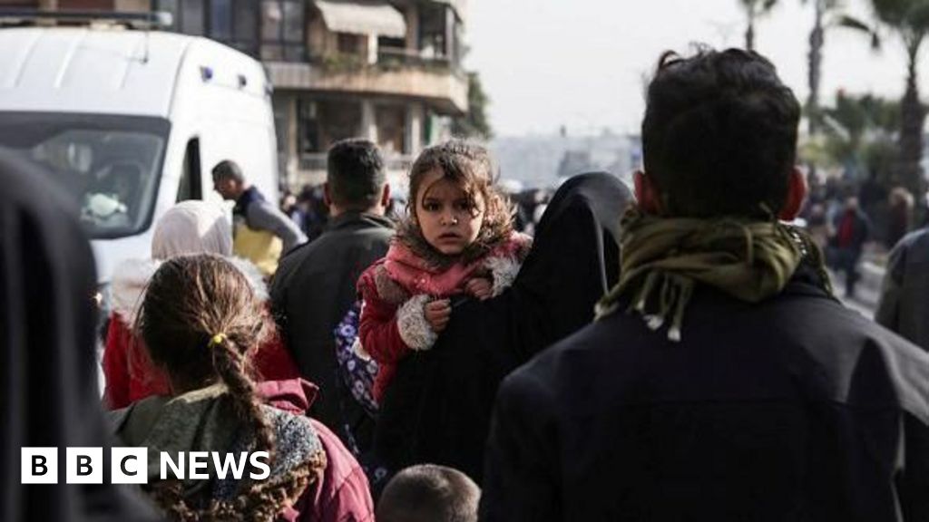 Thousands flee clashes between Syrian government and Kurdish fighters in Aleppo
