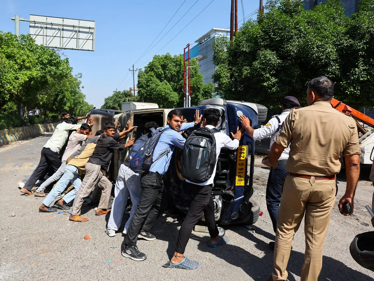 Tear gas fired at India workers demanding higher wages as living costs rise
