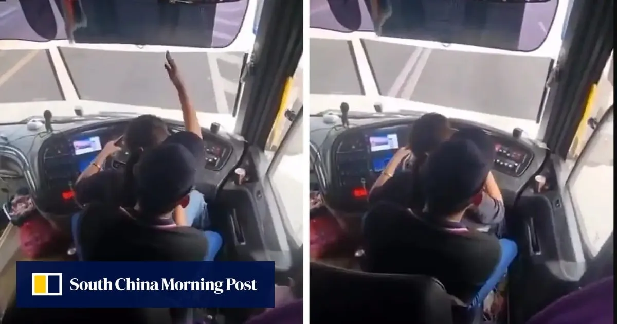 Malaysian police hunt bus driver seen with woman on lap in viral video