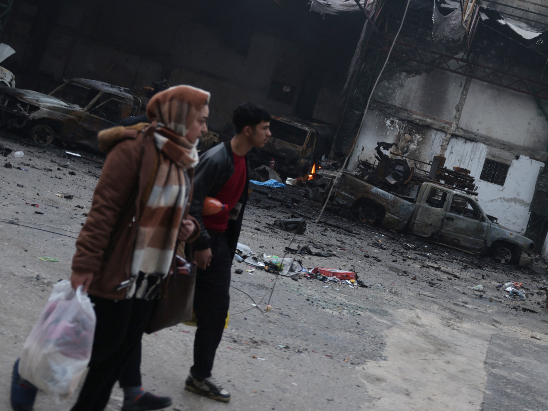 Syrians in Kurdish areas of Aleppo pick up pieces after clashes