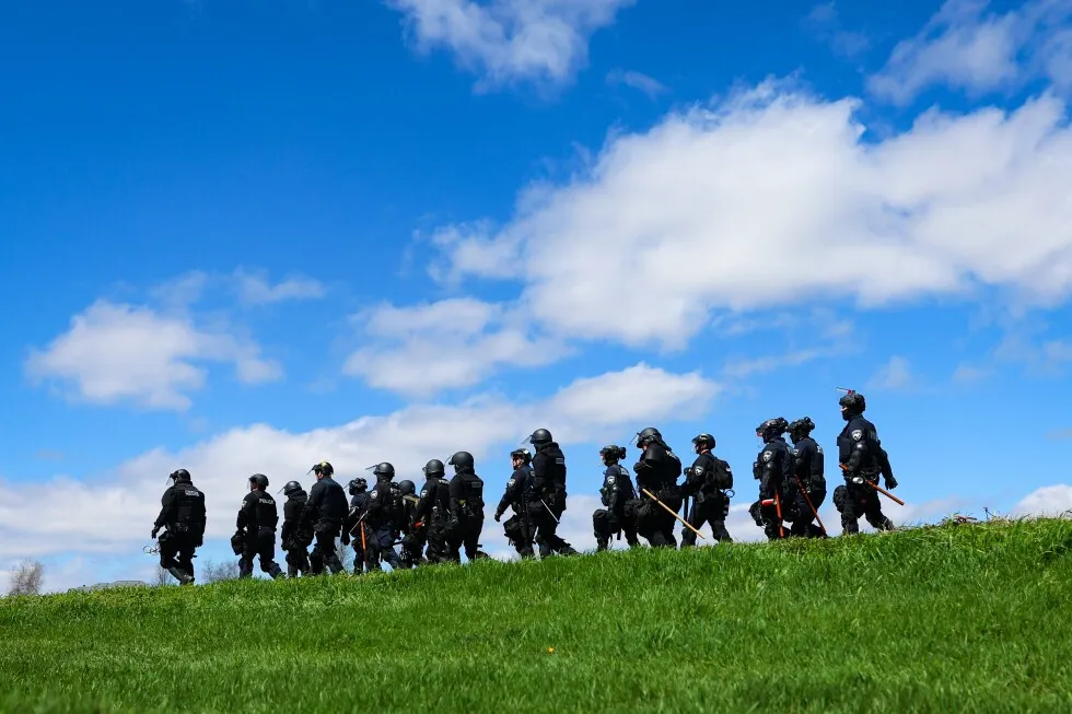 Wisconsin authorities put total arrests from clashes at beagle breeding facility at about 25