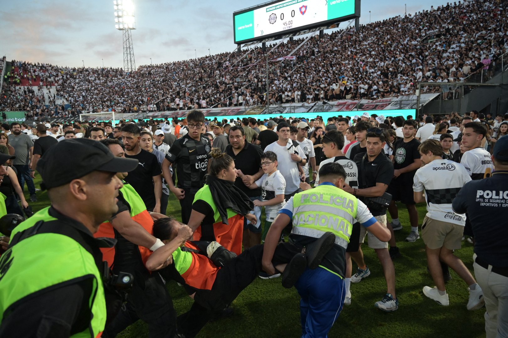 Several injured as fans clash with police in Paraguay’s Superclasico match