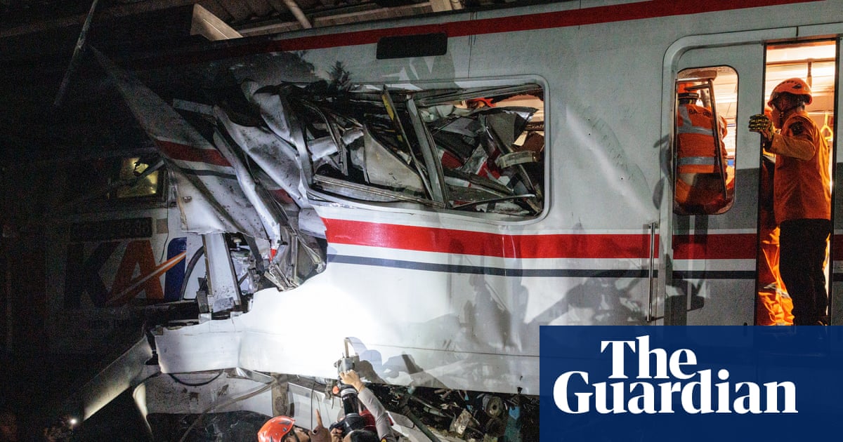 Train collision in Indonesia kills seven as rescuers work to reach survivors