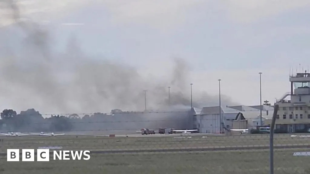 Two dead after small plane crashes into Australia airport hangar