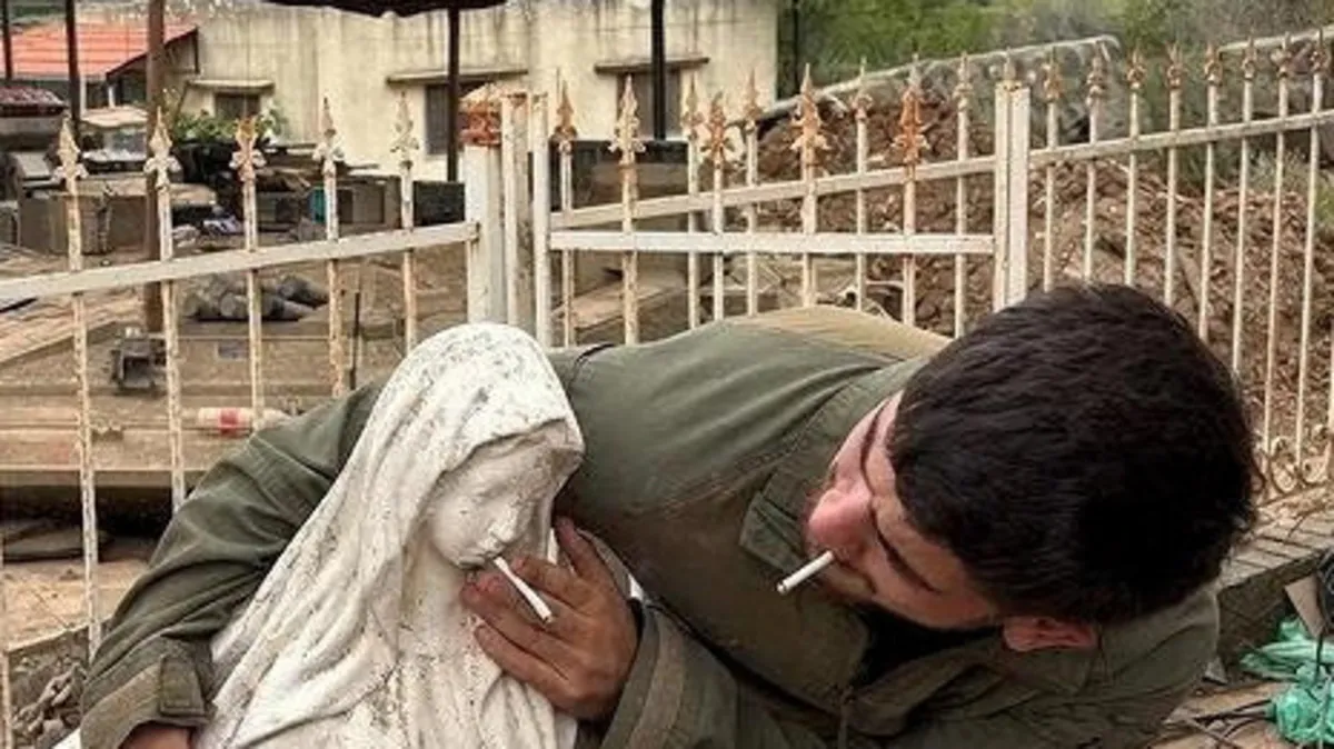 Photo shows Israeli soldier desecrating Virgin Mary statue in Lebanon