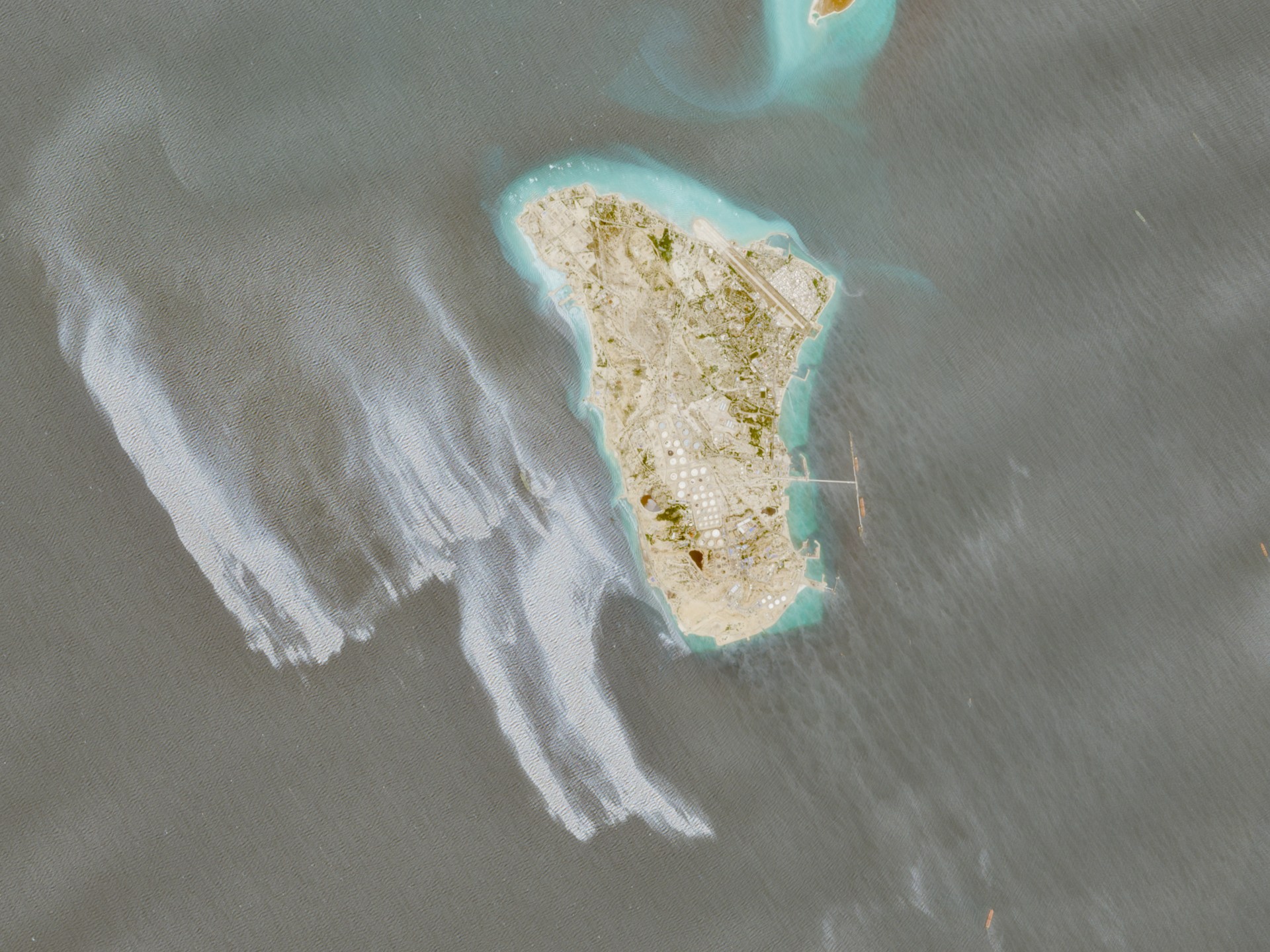 Satellite images show likely oil slick off Iran’s Kharg Island