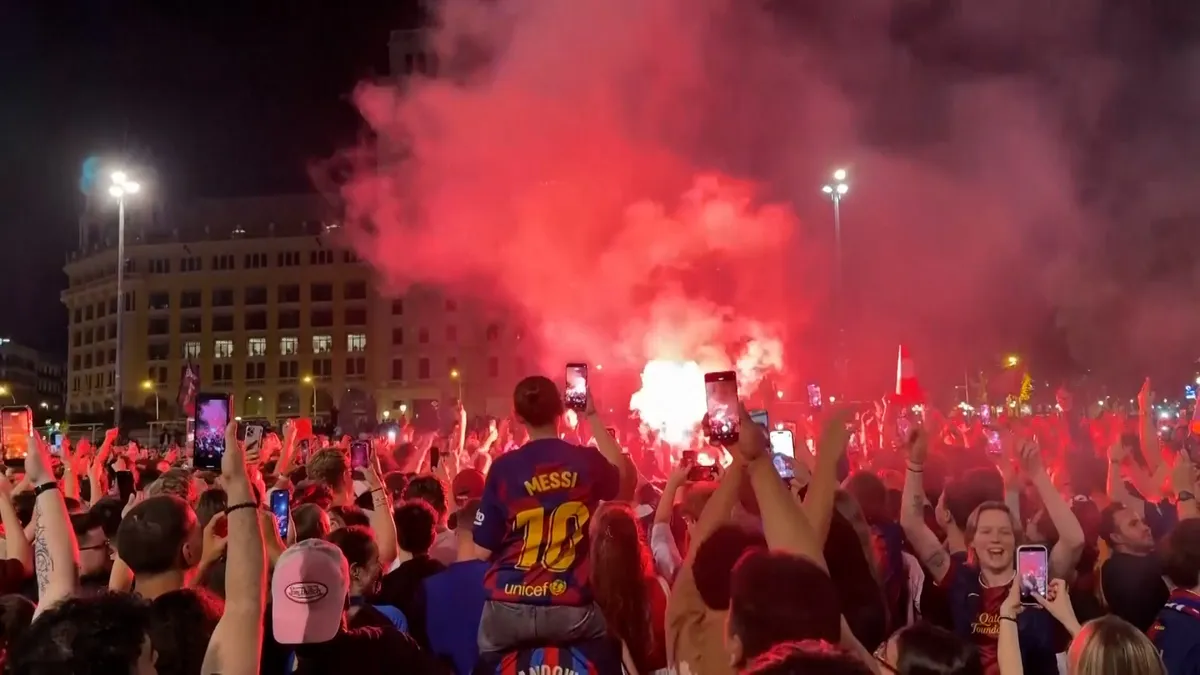 Fans celebrate as Barcelona clinches LaLiga title