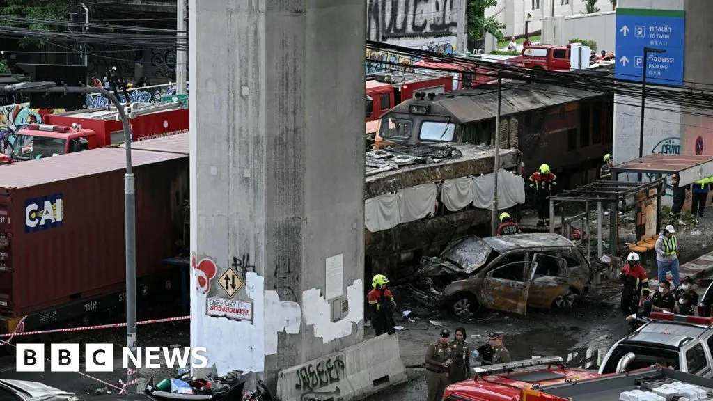 Freight train and bus crash kills at least eight in Bangkok