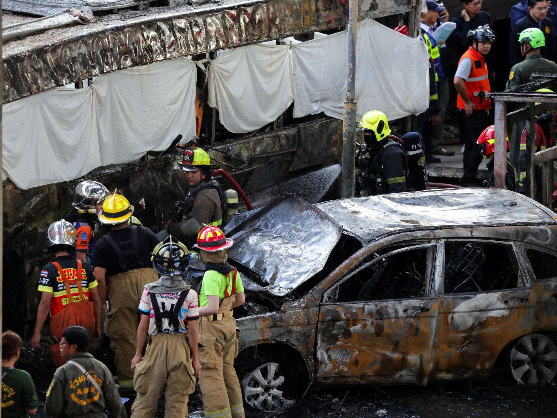 At least eight killed, 25 injured as train hits bus in Bangkok