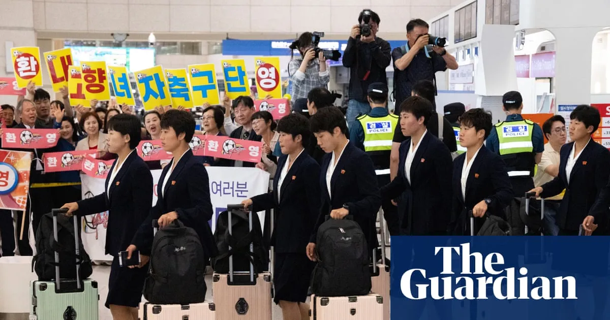 ‘Tearing down barriers’: North Korean footballers arrive in Seoul for first time in eight years
