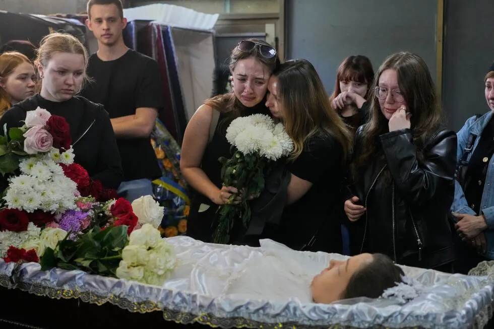 Young Kyiv couple killed in a fierce Russian airstrike hoped to start a family, mourners say
