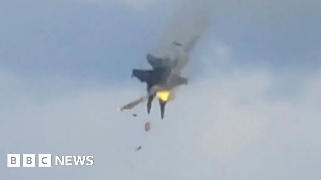 Moment two fighter jets collide mid-air at US air show