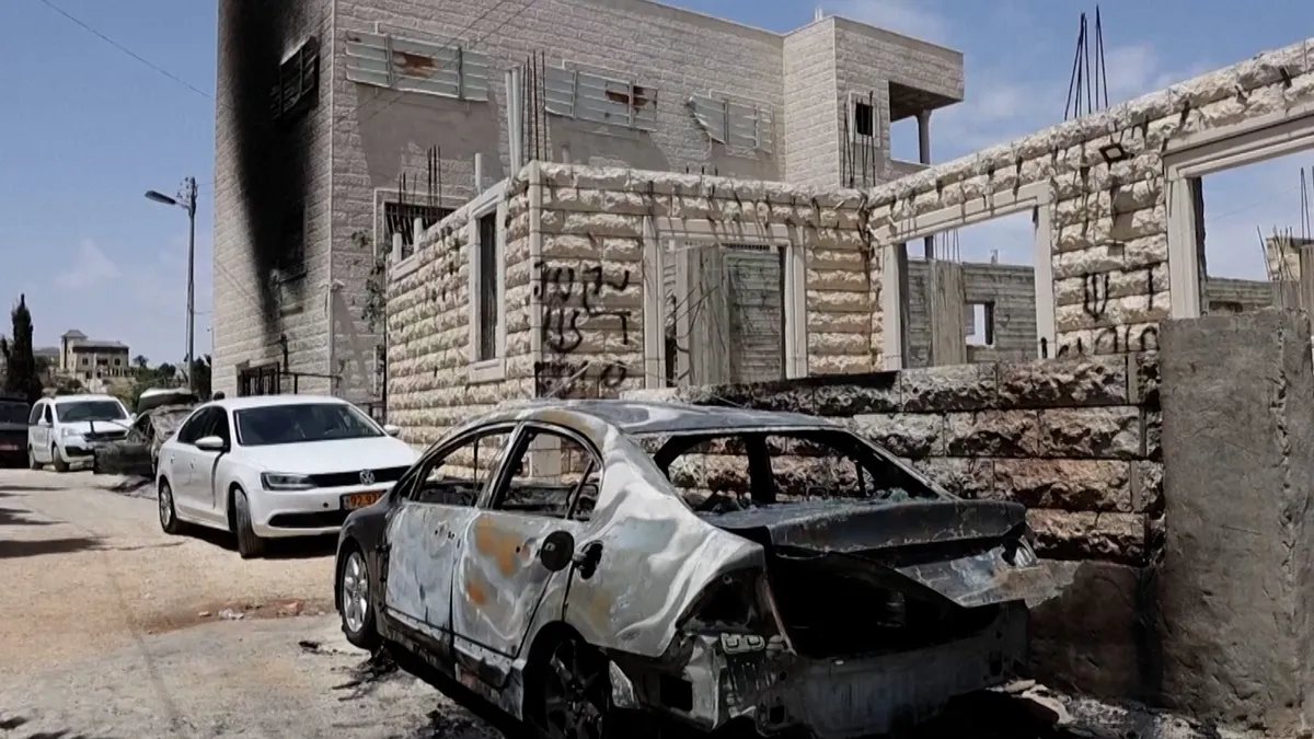 Israeli settlers burn vehicles, install caravans in occupied West Bank