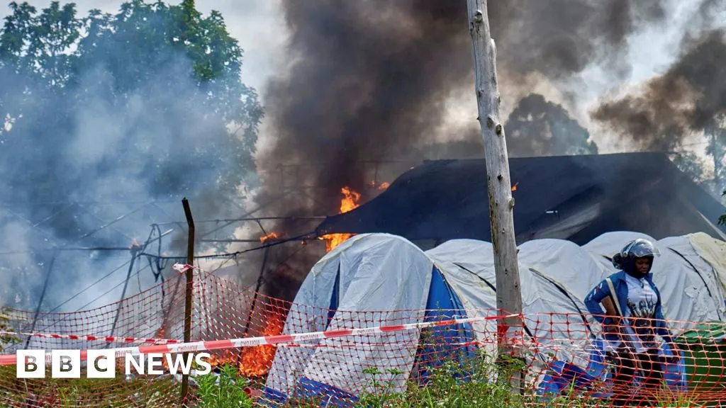 Angry crowd sets Ebola hospital tents on fire in DR Congo