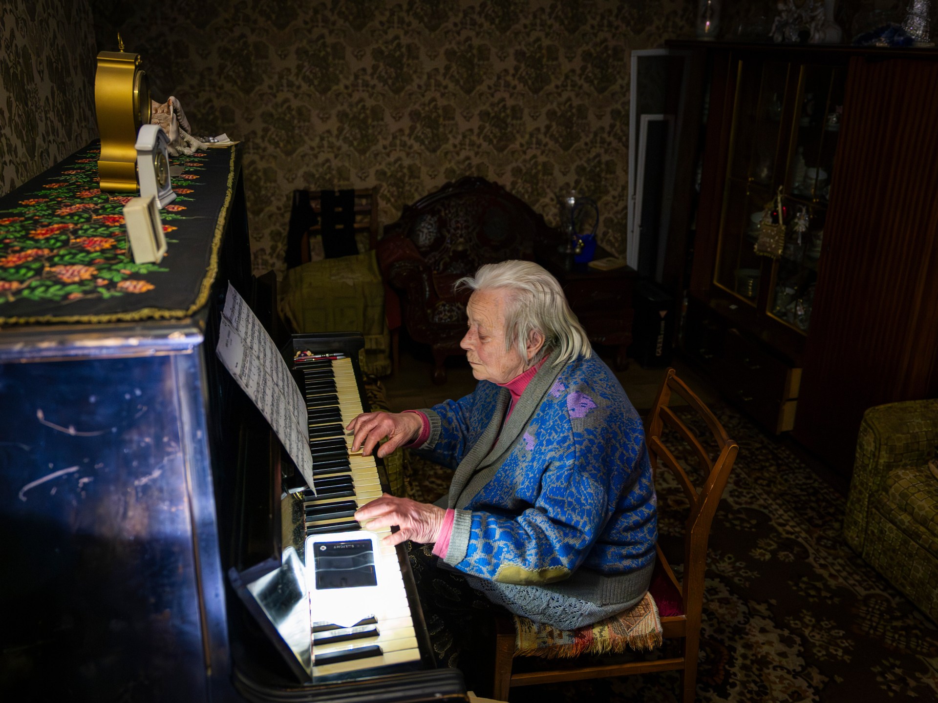 Photos: Power outages leave people in freezing conditions in Kyiv