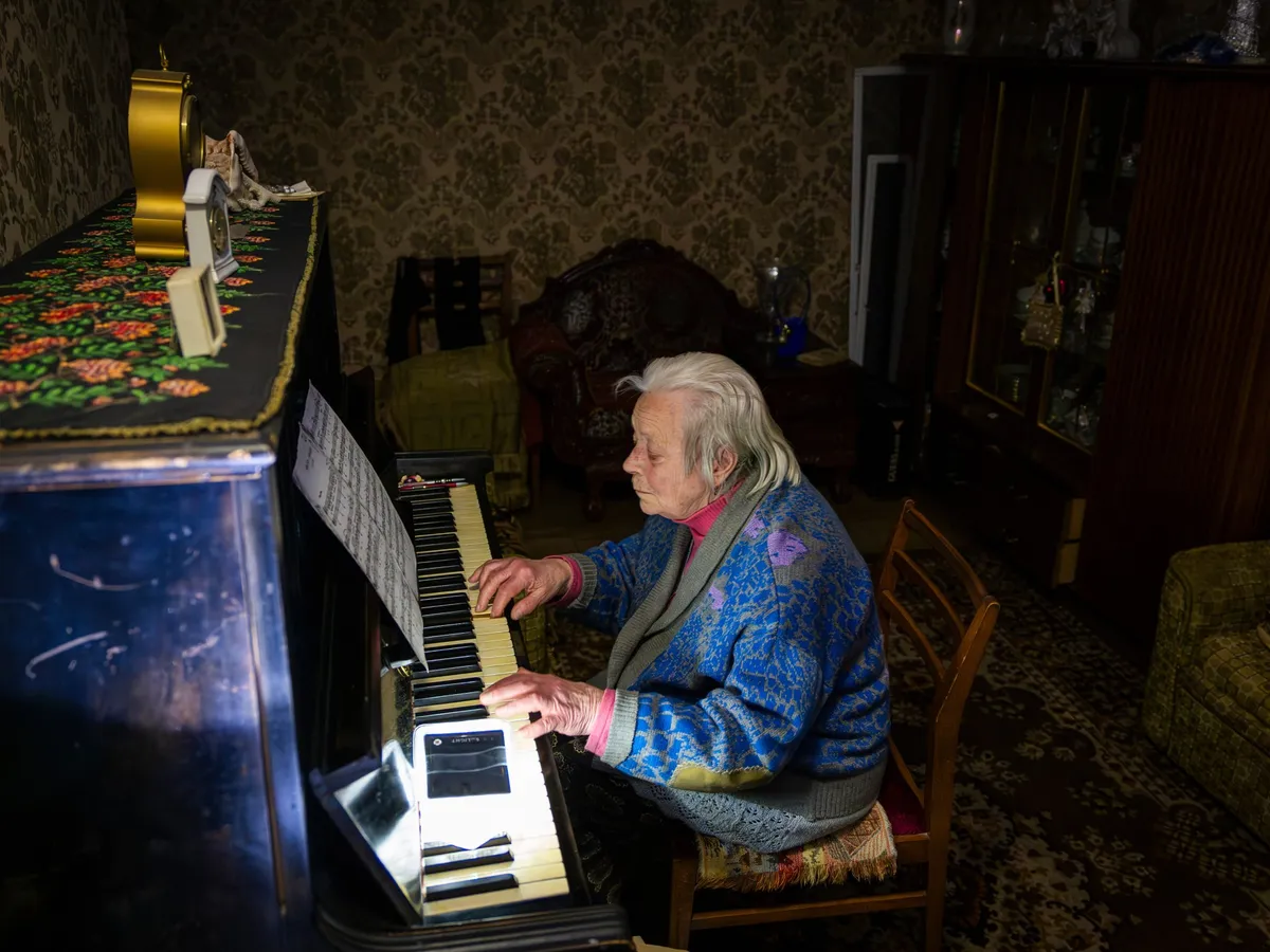 Photos: Power outages leave people in freezing conditions in Kyiv
