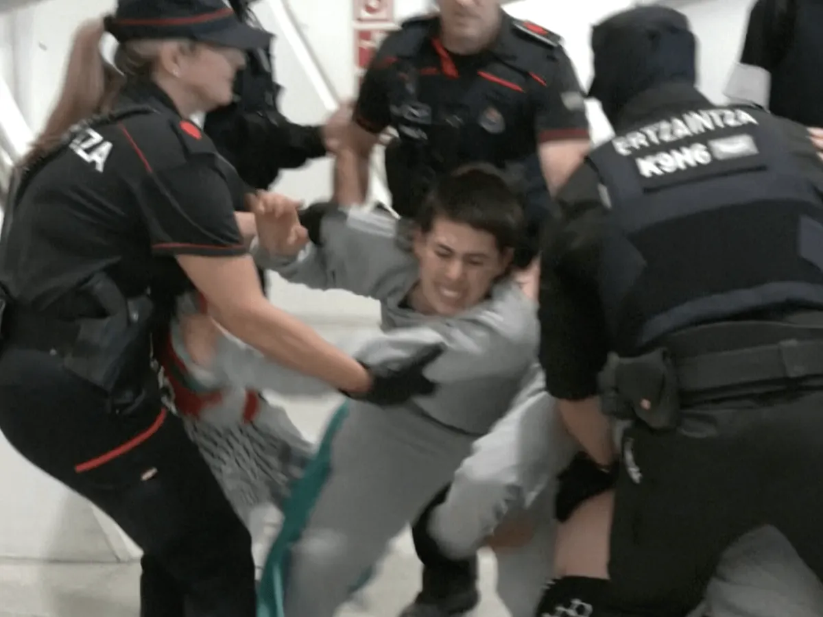 Police beat and detain Gaza flotilla activists at airport