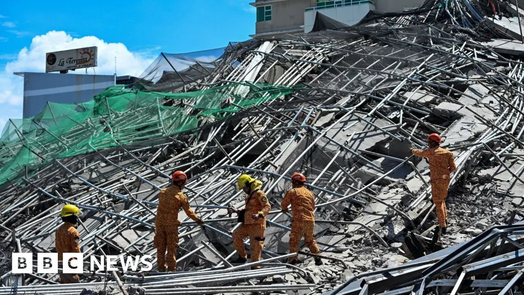 People trapped under collapsed building in Philippines