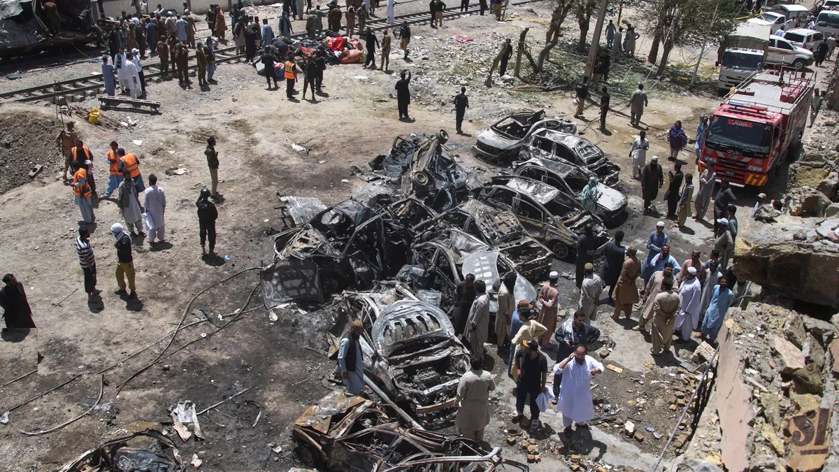 Suicide car bombing attack on a train in Pakistan kills dozens