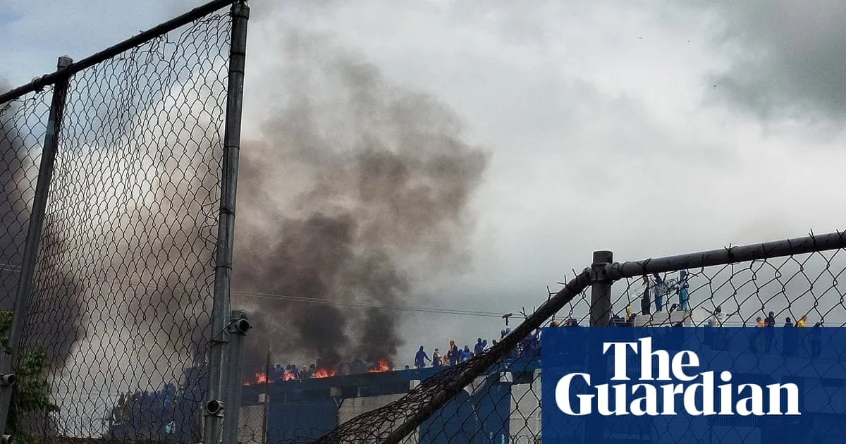 Venezuela inmates occupy prison roof and set fire to mattresses to protest alleged abuses