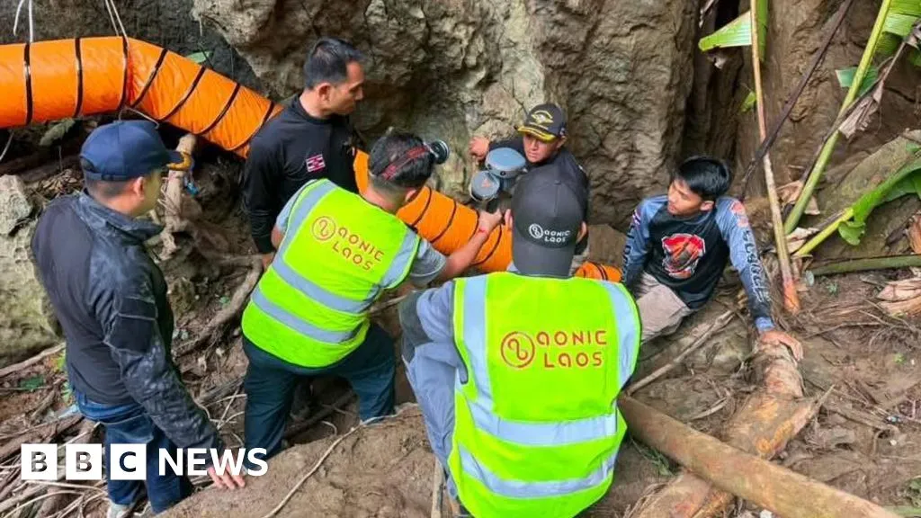Rescuers race to free seven people trapped in flooded Laos cave