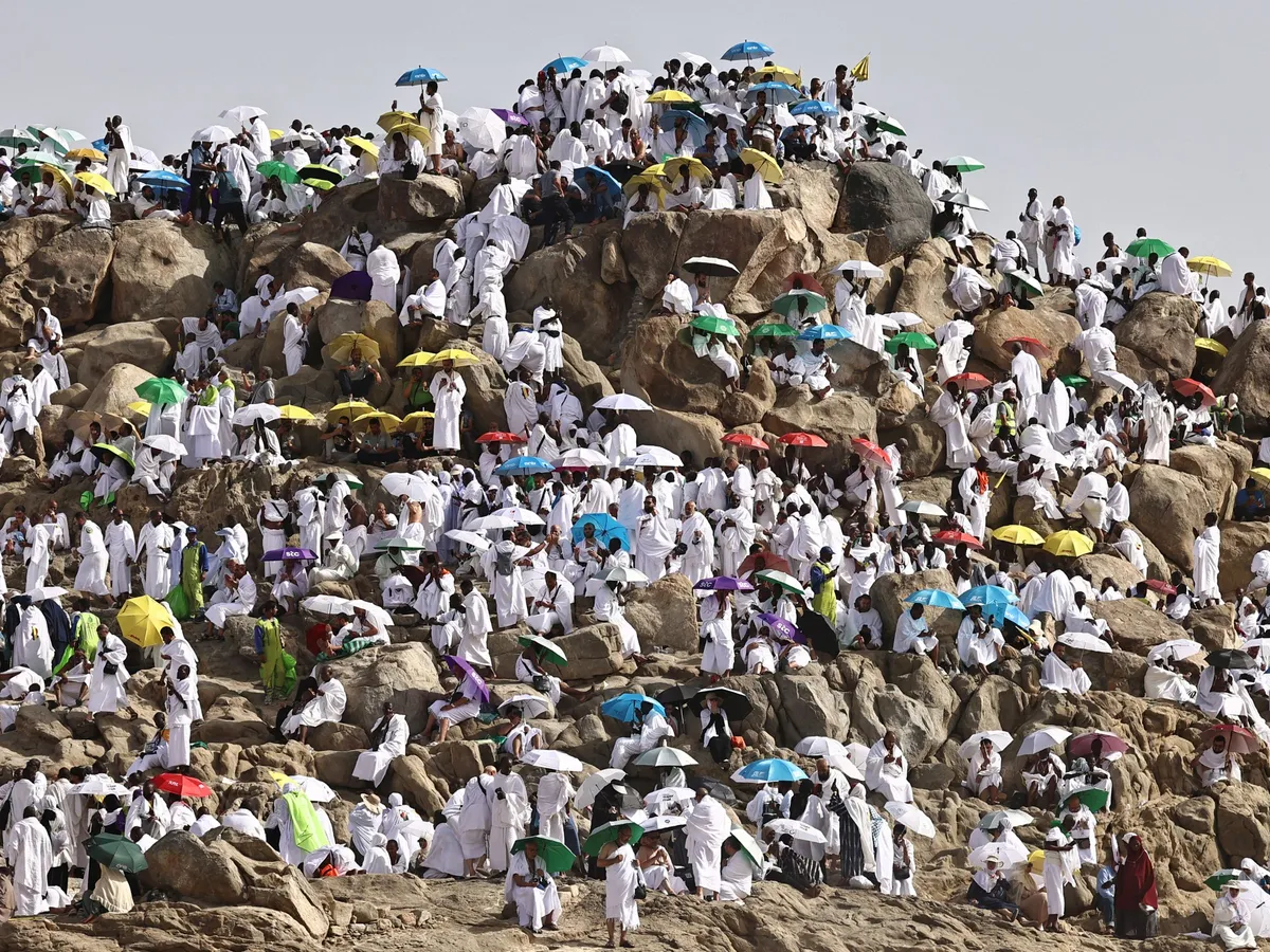 Hajj pilgrims gather at Mount Arafat under scorching desert sun