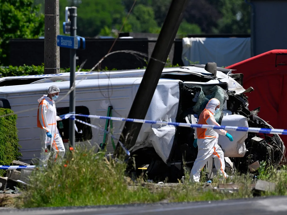 Four people killed after minibus collides with train in Belgium
