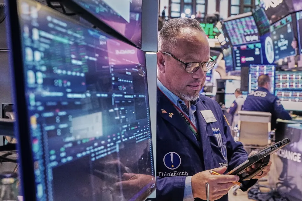 Wall Street hangs near its records as profits keep piling up for US companies and oil prices swing