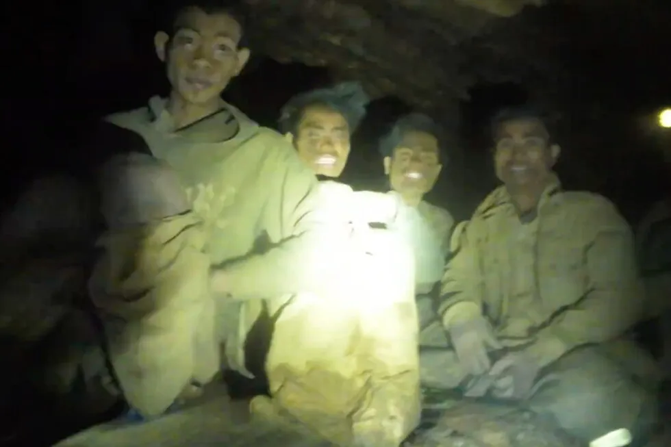 Rescuers work to drain flooded Laos cave to free 5 villagers and search for 2 still missing