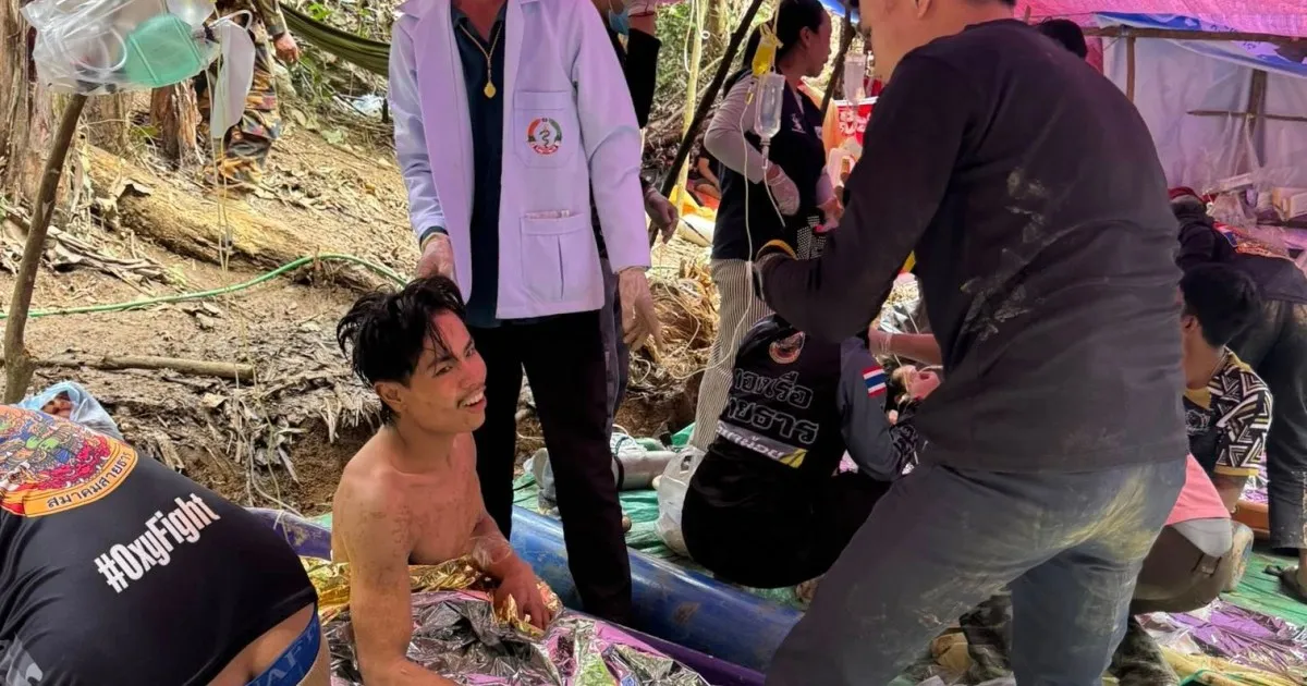 Rescuers free four more men from flooded Laos cave, two still missing