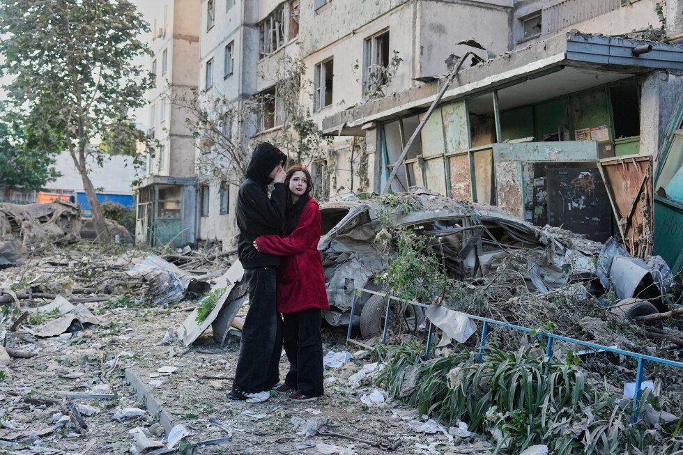 Russian attack on Ukraine capital kills at least 3 and traps others in damaged buildings