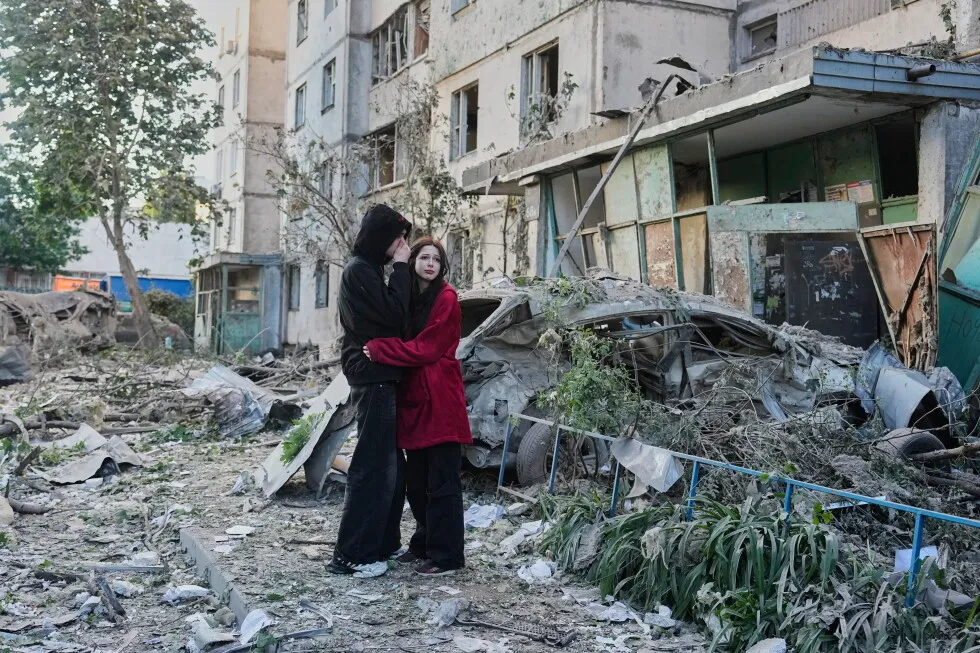 Russian attack on Ukraine capital kills at least 3 and traps others in damaged buildings