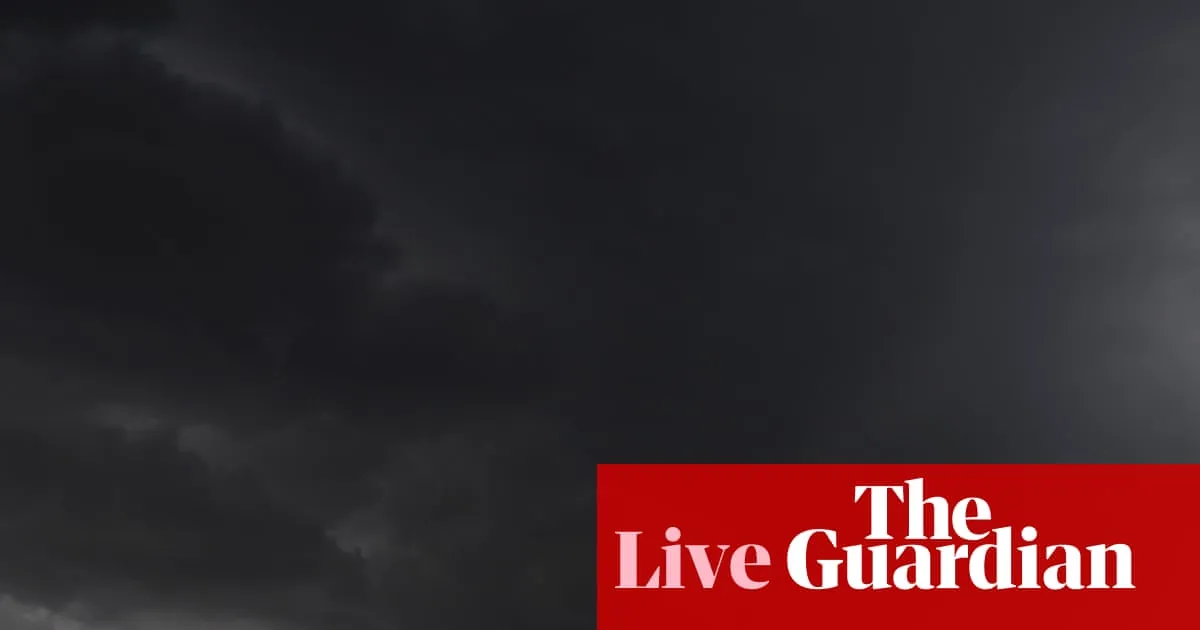 Australia news live: woman dead in powerful storm as landslide and flood warnings issued for Sydney