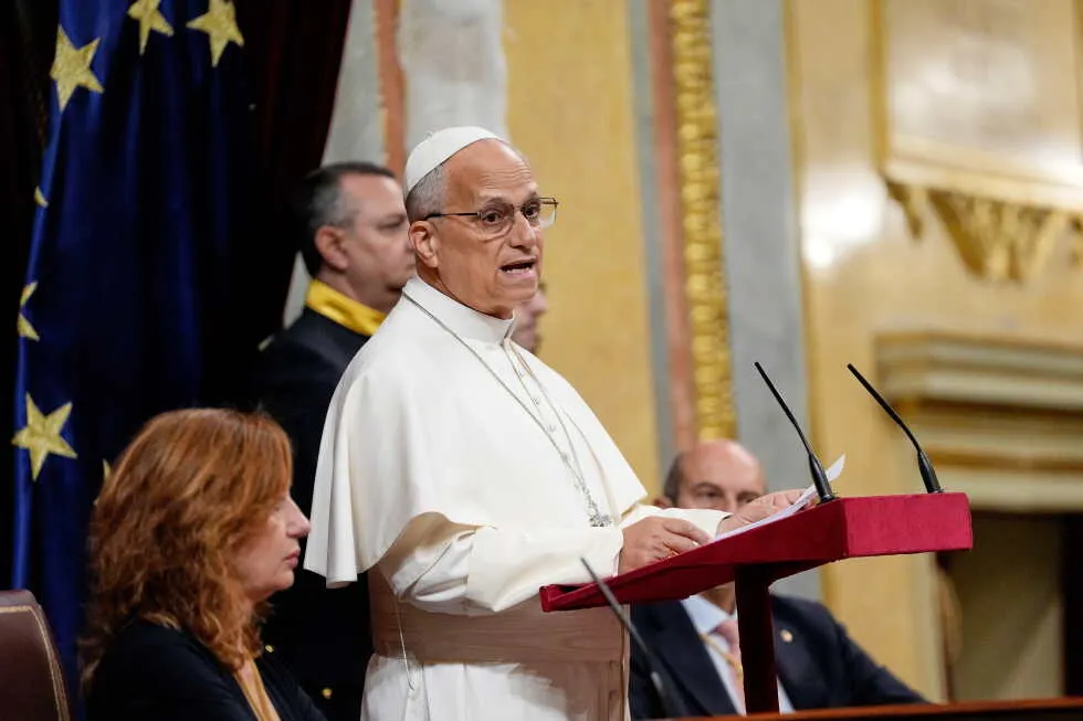 Pope’s historic speech to Spain’s parliament demands respect for migrants and gets 7-minute ovation