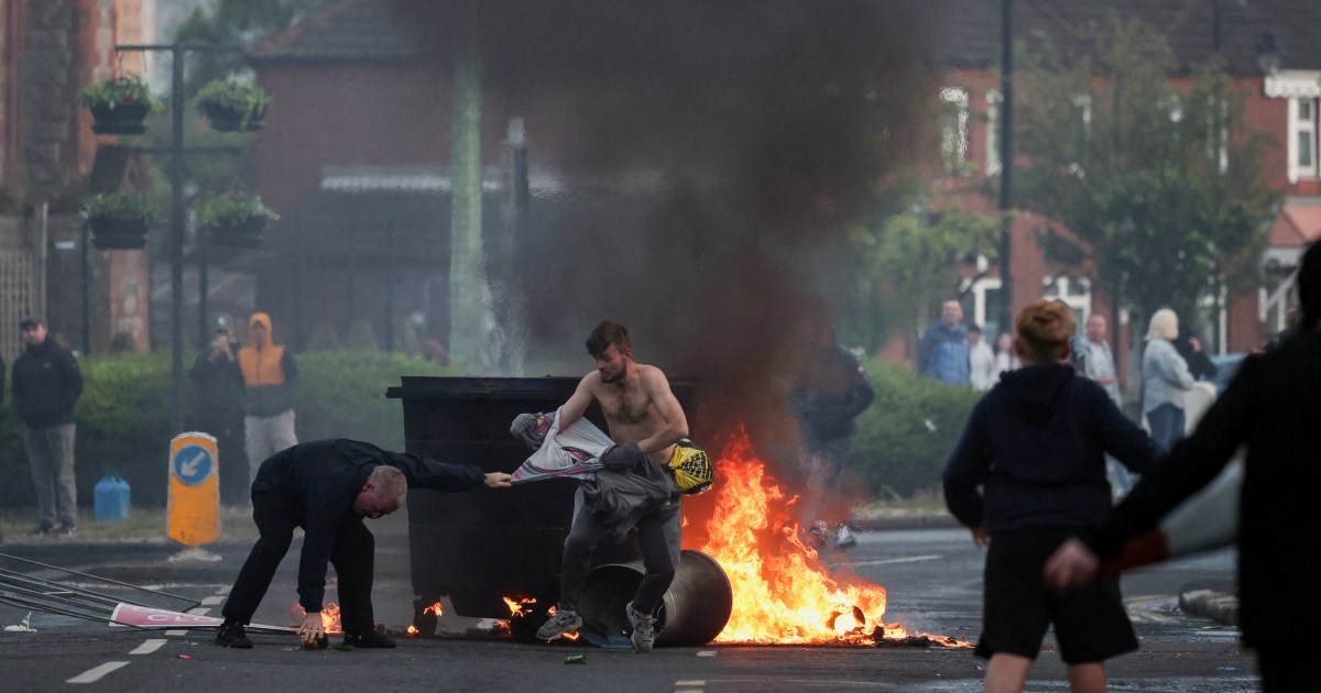 Protesters torch cars, buildings in Belfast after refugee knife attack