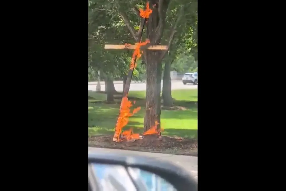 Police are investigating a large burning cross at a Chicago park