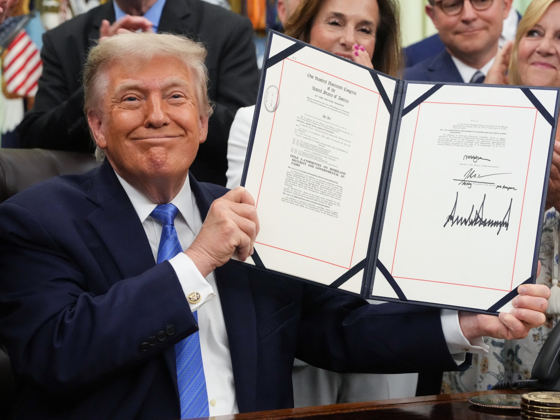 After a Democrat standoff, Trump signs $70bn immigration enforcement bill