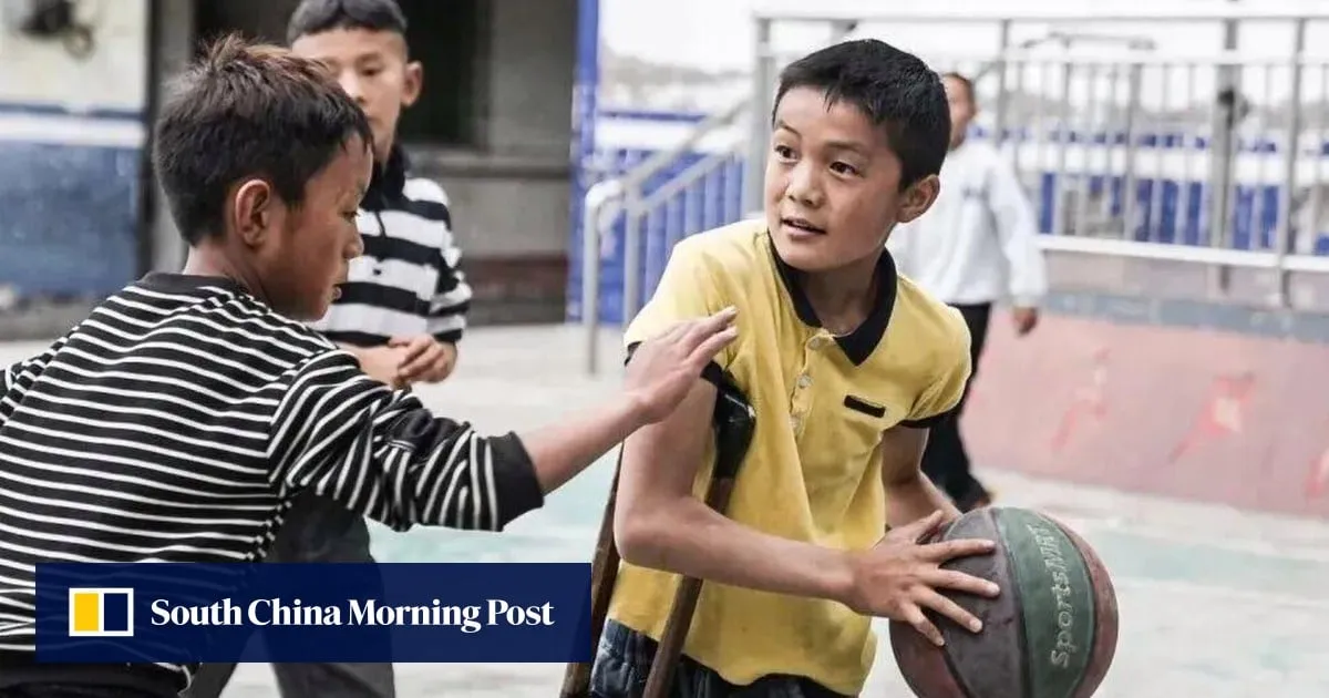 One-legged China teen boy dreams of basketball glory, practising with a crutch made by dad