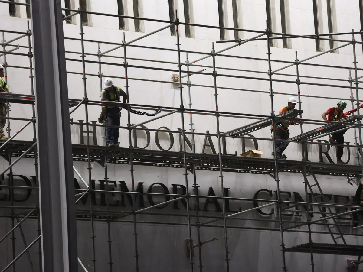 Workers remove Trump’s name from Kennedy Center after court ruling