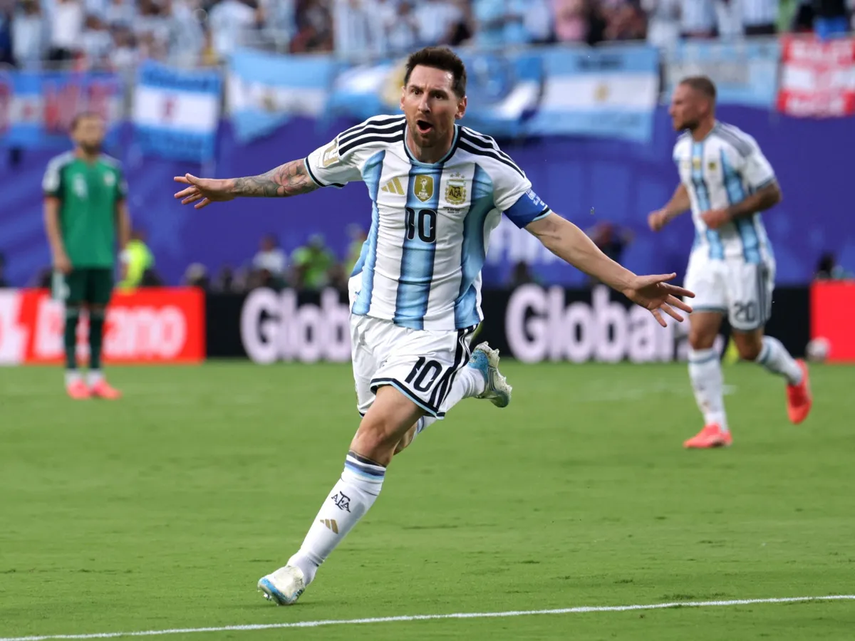 Messi hat-trick fires holders Argentina to win over Algeria at World Cup